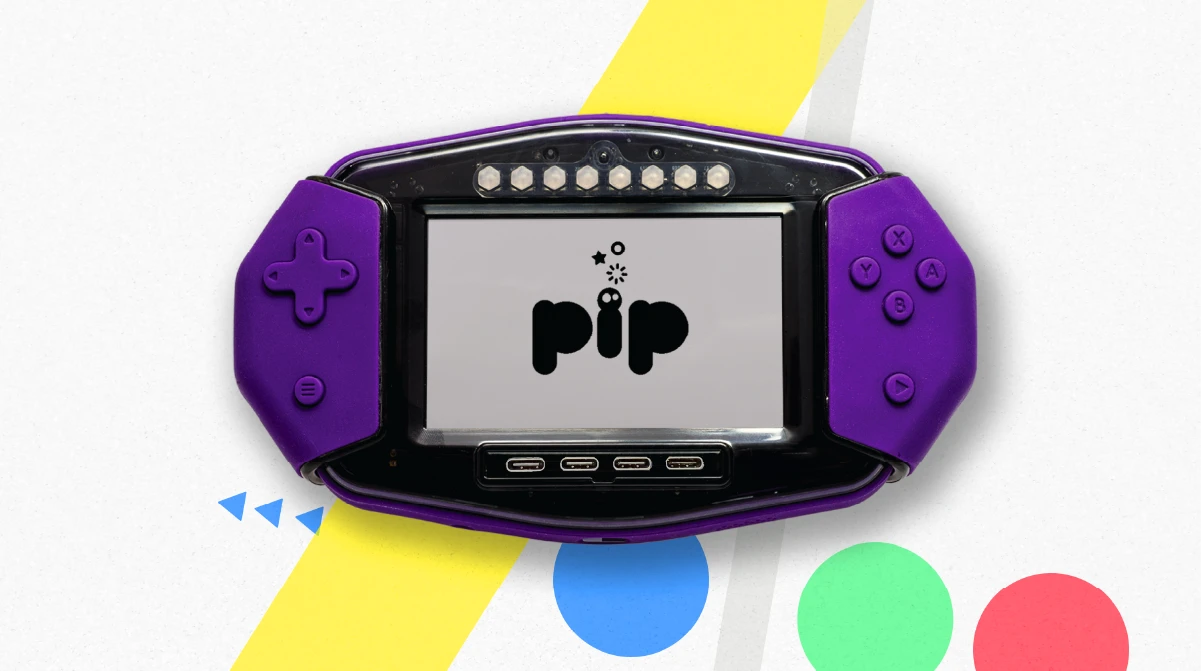 The Pip handheld computer, a purple, Raspberry Pi-powered device with a touchscreen and detachable game controllers