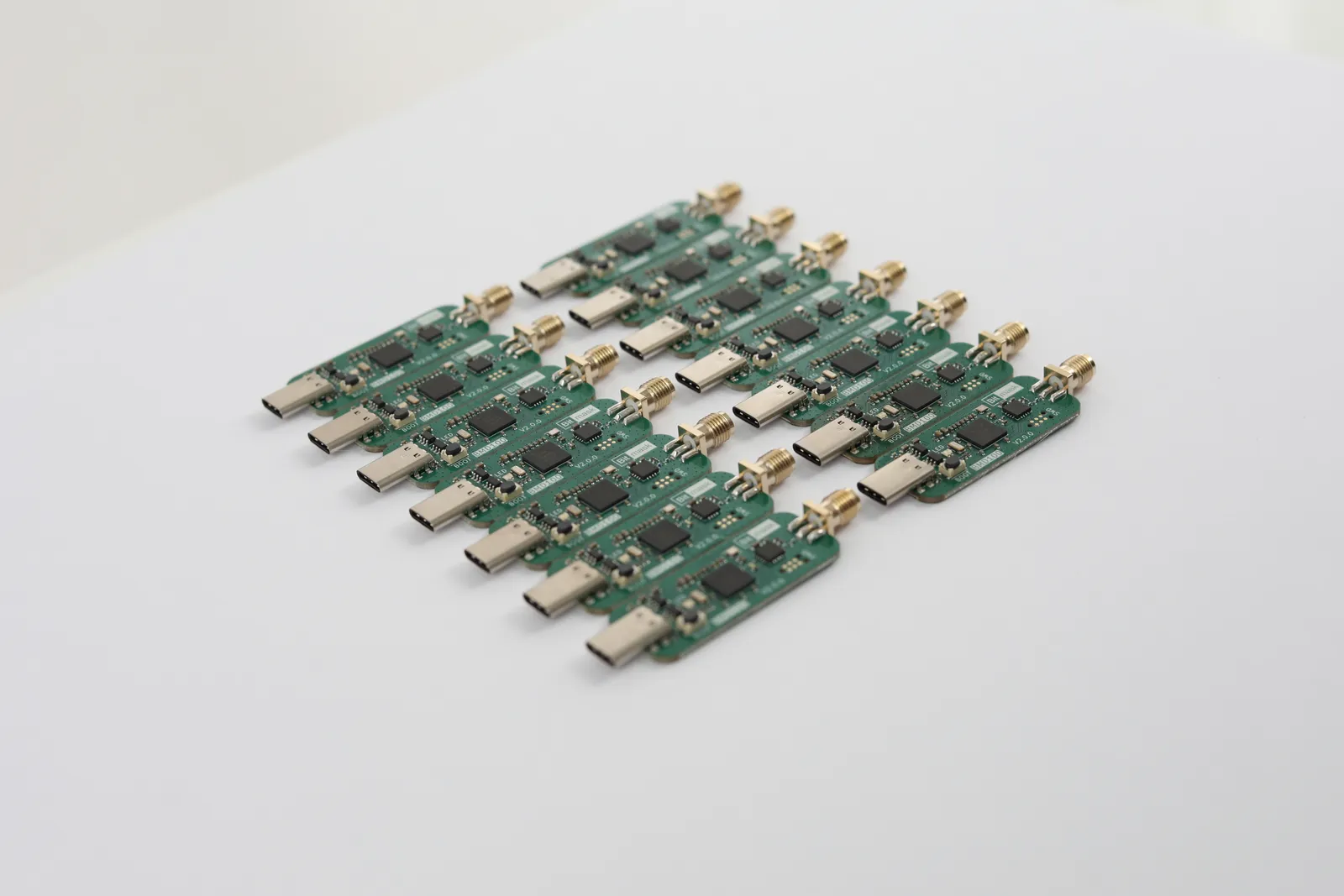 A flat lay of bare BMD100 boards arranged in rows